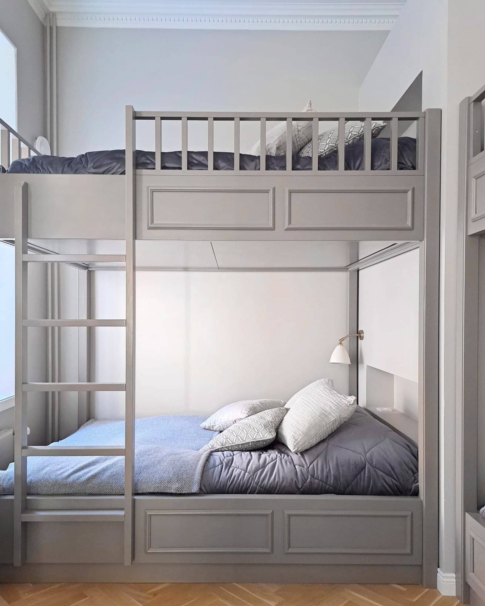 Cabinet Maker Helsinki: Custom bunk bed in pine with panelled ends and railings, painted to match the wall