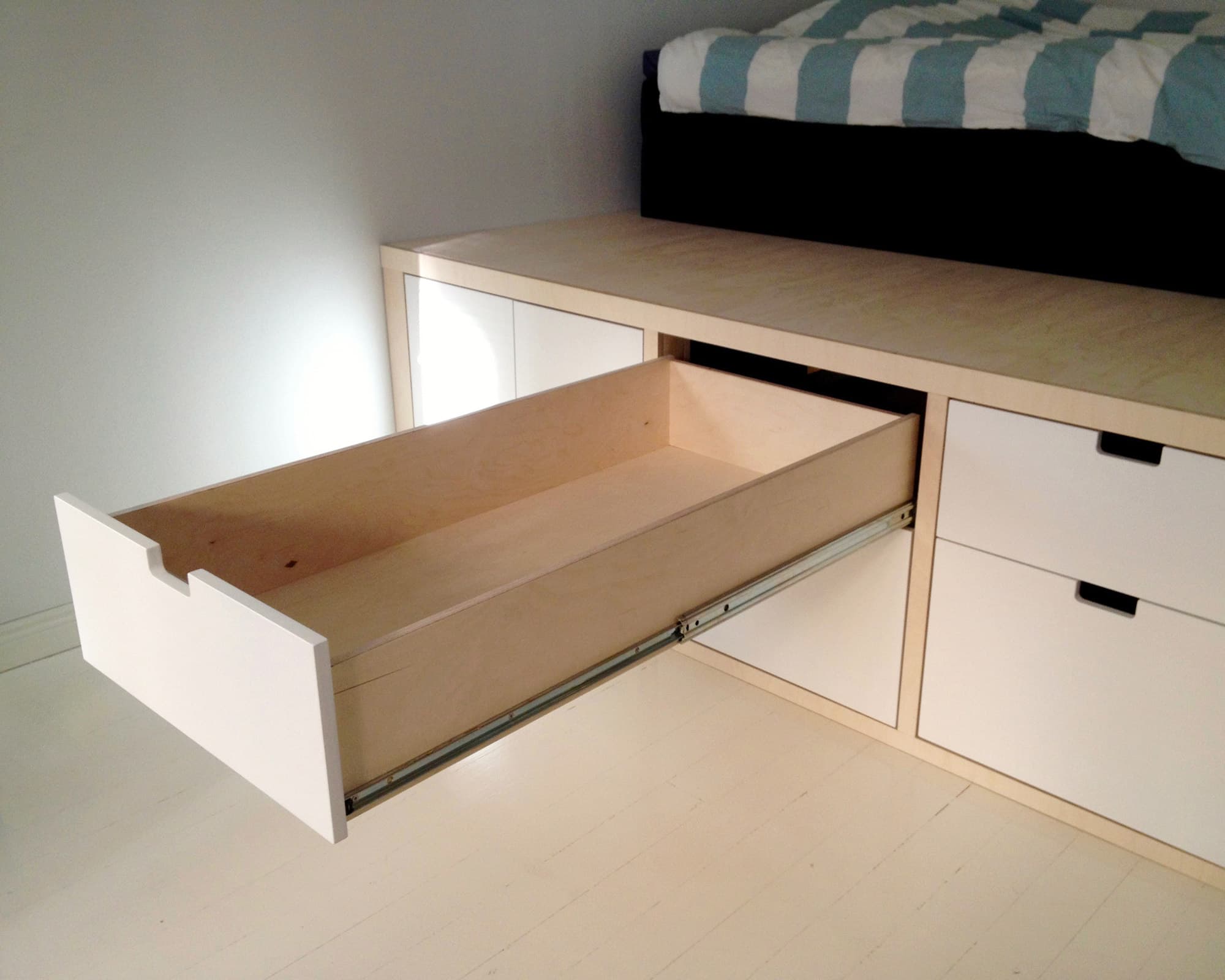 Cabinet Maker Helsinki Rekon Struktio built: Storage drawers built beneath the custom bed, a space-saving solution
